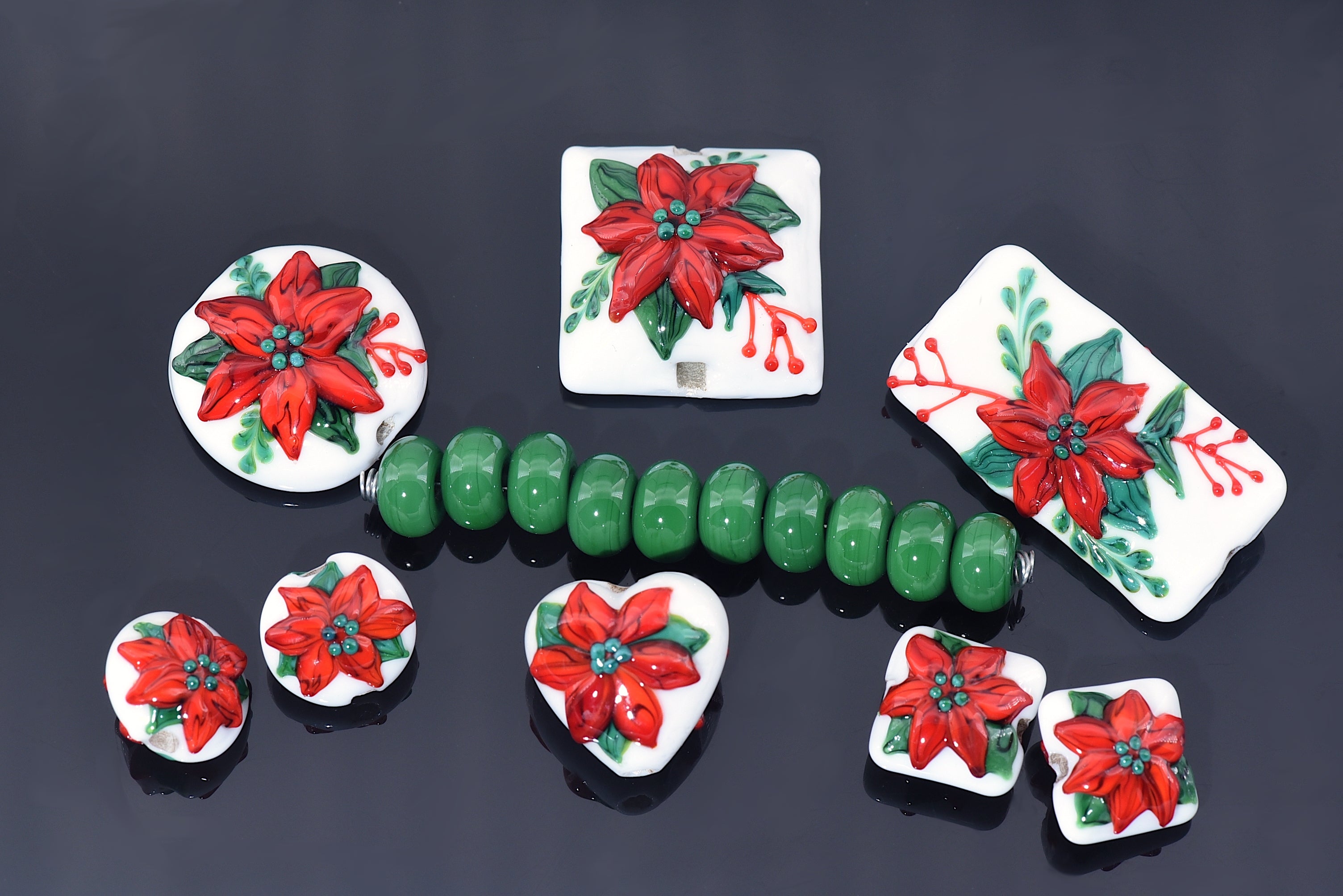 10707801 - Seven Red Poinsettia Christmas Rondelle Beads